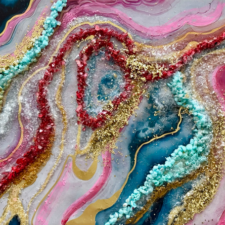 Abstract art piece with colorful swirls on a wooden surface